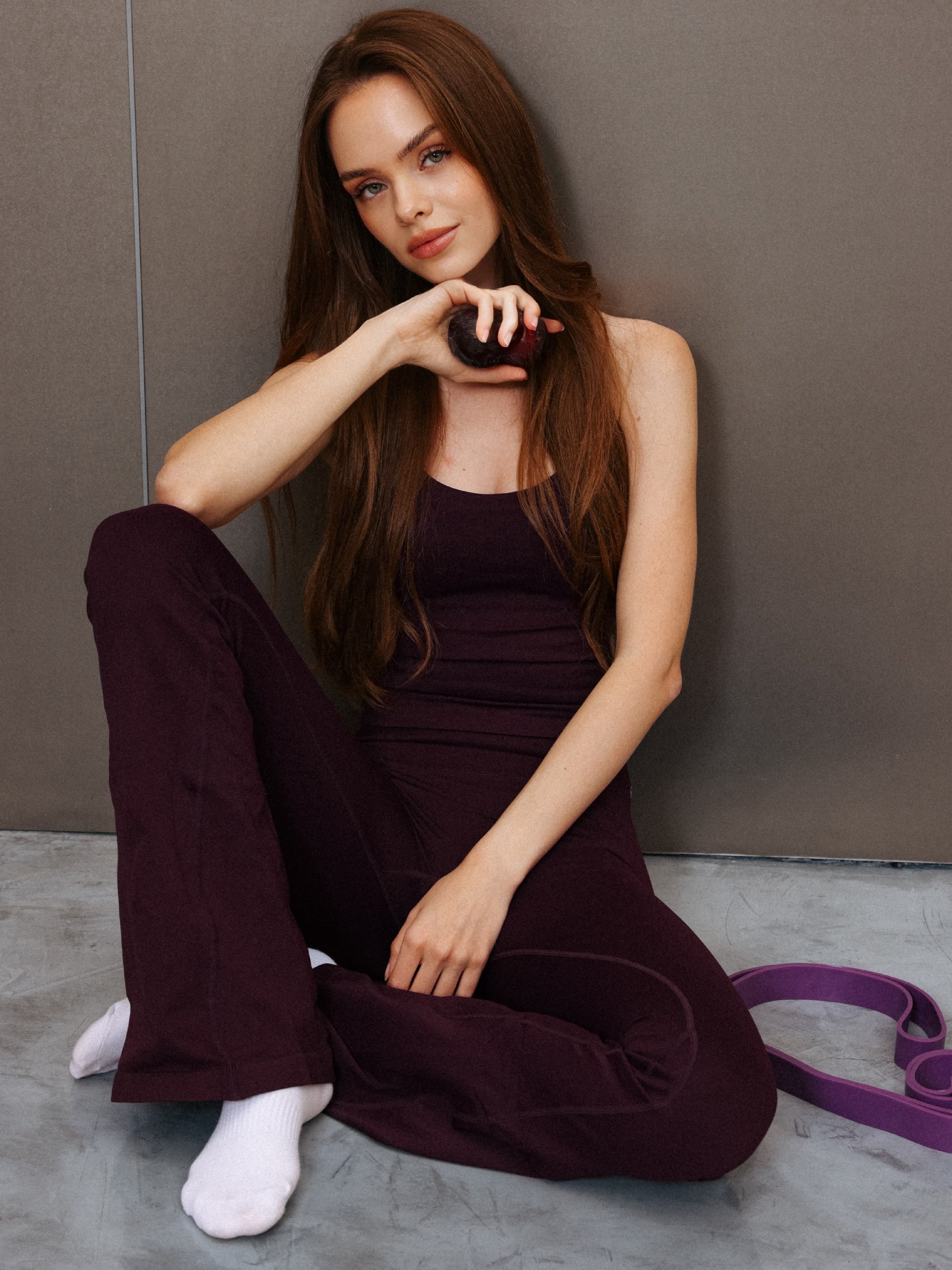 Maria Ivashkevich in a burgundy activewear look